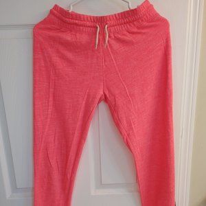 A neon pink mid length pants